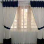 Why are wave curtains used as acorn ustic treatment for rooms?