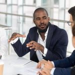 Man-Leading-Team-Discussion